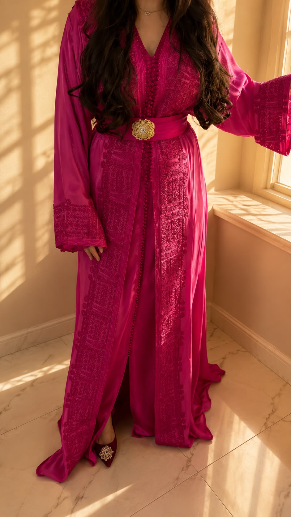 Yasmine Qaftan in fuchsia, by the window